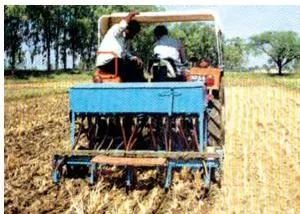 Agriculture Class 10: Contemporary India II Chapter 4 PDF Modern farm equipment at work in a field, showing the technological reforms the agriculture class 10 chapter links to the Green Revolution