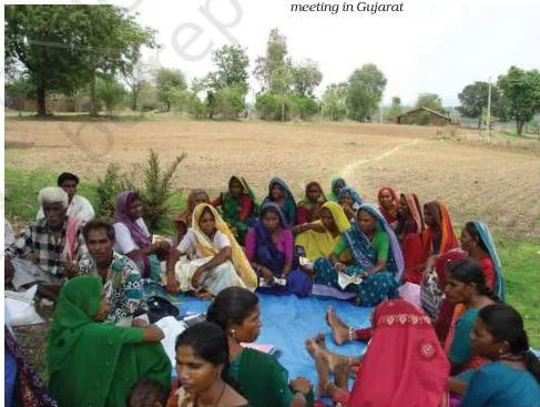 A women's self-help group holding a meeting in Gujarat, demonstrating rural women pooling savings to access credit without individual collateral