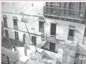 Rooftop rainwater harvesting system adapted in Gendathur village showing the pipe carrying water from a sloping roof into an underground tanka