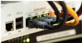 Ethernet cables plugged into a network switch, the device that forwards data only to the destination port