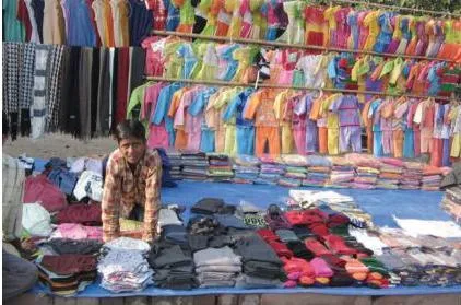 Small traders of readymade garments facing stiff competition from MNC brands and imports, illustrating how opening trade connects markets