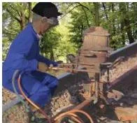Metals and Non-metals Class 10 — NCERT Chapter 3 PDF Glowing molten iron pouring from a crucible into the joint between two railway tracks during the thermit reaction