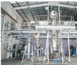 Microbes in Human Welfare Class 12 A fermentation plant — the full industrial setup where fermentors and supporting equipment convert raw material into microbial products