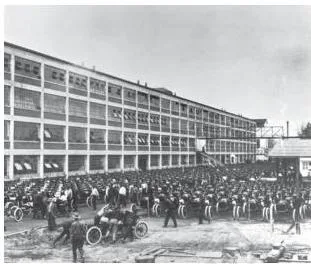 Rows of T-Model Ford automobiles lined up outside the factory, the world's first mass-produced car