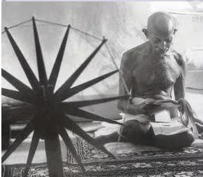 Mahatma Gandhi seated at the spinning wheel, the charkha, the image that became the most abiding symbol of Indian nationalism